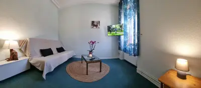 Un ou plusieurs lits dans un hébergement de l'établissement Gite Fougère 2 à 6 personnes avec SPA et salle de jeux dans la résidence