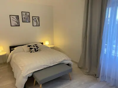 Un ou plusieurs lits dans un hébergement de l'établissement Le Grand DOLLFUS, 90m2 de charme au coeur de ville
