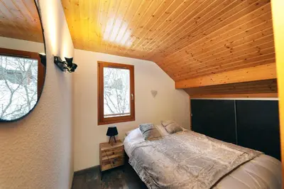 Un ou plusieurs lits dans un hébergement de l'établissement CHALET 6 PERS INDEPENDANT PROCHE CENTRE ET LAC