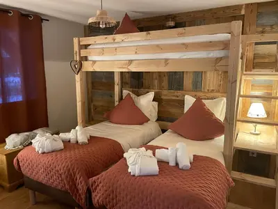 Un ou plusieurs lits dans un hébergement de l'établissement Nouveau Gîte Bain Nordique