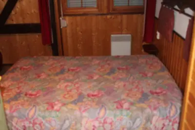 Un ou plusieurs lits dans un hébergement de l'établissement appartement mitoyen dans chalet