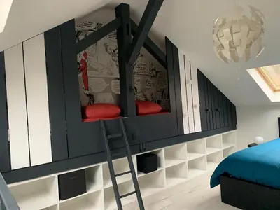 Un ou plusieurs lits dans un hébergement de l'établissement Au Paradis du Loft Joyeux