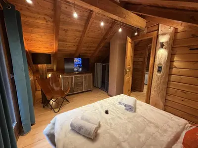 Un ou plusieurs lits dans un hébergement de l'établissement LE RENARD Chalet en bois