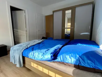 Un ou plusieurs lits dans un hébergement de l'établissement Appartement Le lion