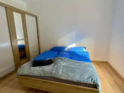 Un ou plusieurs lits dans un hébergement de l'établissement Appartement Le lion