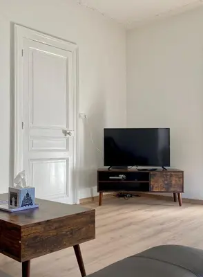 Télévision ou salle de divertissement dans l'établissement Appartement Le lion