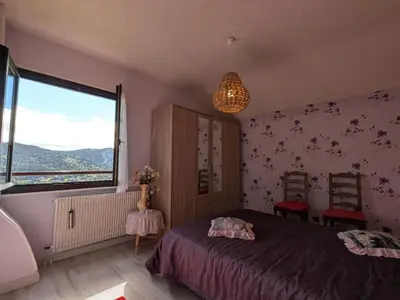Un ou plusieurs lits dans un hébergement de l'établissement Gîte fonctionnel avec terrasse et vue, Gérardmer - FR-1-589-402