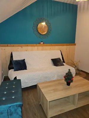 Un ou plusieurs lits dans un hébergement de l'établissement Gite Eglantine 2 à 6 personnes avec SPA et salle de jeux dans la résidence