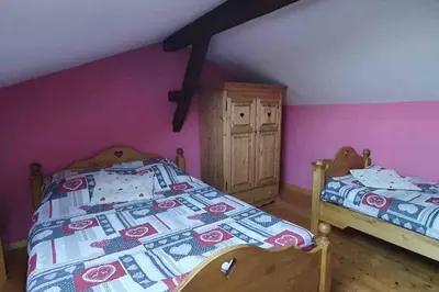 Un ou plusieurs lits dans un hébergement de l'établissement Chalet duplex avec terrasse entièrement équipé60m2
