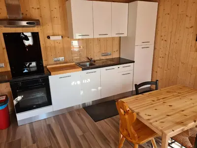 Cuisine ou kitchenette dans l'établissement Le chalet du bois joli