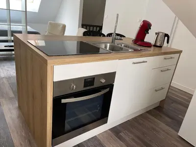 Cuisine ou kitchenette dans l'établissement Le 33 le Haut