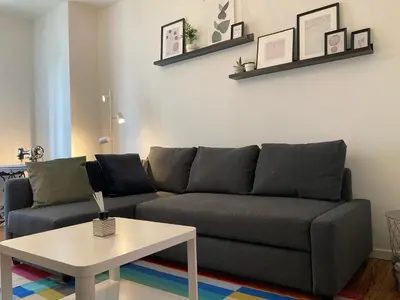 Coin salon dans l'établissement Appartement avec place de parking et box vélos