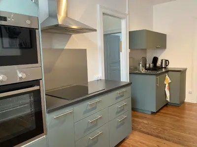 Cuisine ou kitchenette dans l'établissement Appartement avec place de parking et box vélos