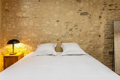 Un ou plusieurs lits dans un hébergement de l'établissement Le 01-GregIMMO-Appart'Hôtel