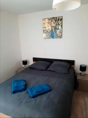 Un ou plusieurs lits dans un hébergement de l'établissement Charmant logis en duplex