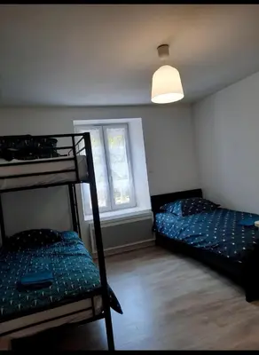 Un ou plusieurs lits dans un hébergement de l'établissement Charmant logis en duplex