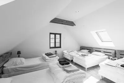 Un ou plusieurs lits dans un hébergement de l'établissement La Désirade Incroyable lodge typique dans les Vosges du Sud
