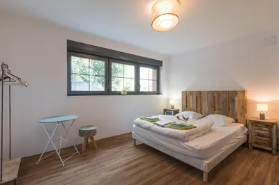 Un ou plusieurs lits dans un hébergement de l'établissement La Désirade Incroyable lodge typique dans les Vosges du Sud