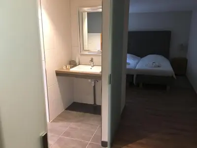 Un ou plusieurs lits dans un hébergement de l'établissement Hotel Elisabeth