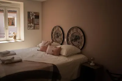 Un ou plusieurs lits dans un hébergement de l'établissement Gîte Chez Tim