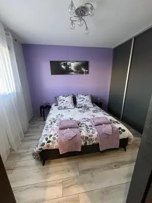 Un ou plusieurs lits dans un hébergement de l'établissement CHAMBRE D'HOTES DANS MAISON PROCHE de COLMAR