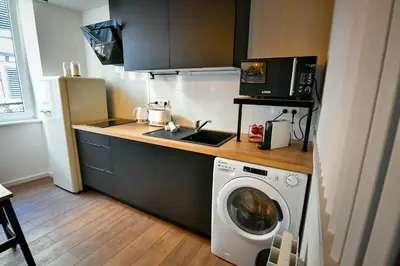 Cuisine ou kitchenette dans l'établissement Au Fil du Temps