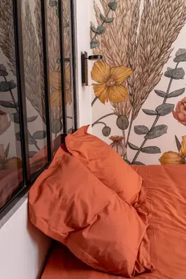 Un ou plusieurs lits dans un hébergement de l'établissement Appartement Cosy avec Jardin au Centre Historique de Sélestat & Proche Europa-Park