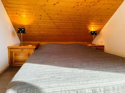 Un ou plusieurs lits dans un hébergement de l'établissement Chalet Gentiane