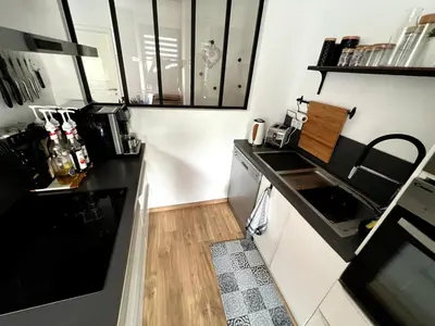 Cuisine ou kitchenette dans l'établissement Chambre cosy, proche centre-ville et gare