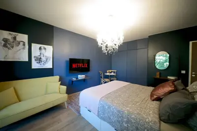Un ou plusieurs lits dans un hébergement de l'établissement Le Boudoir, Centre ville, Parking couvert inclus