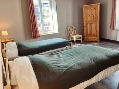 Un ou plusieurs lits dans un hébergement de l'établissement Le Nordmann - au coeur de Gérardmer
