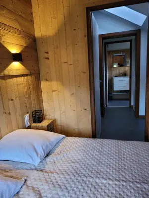 Un ou plusieurs lits dans un hébergement de l'établissement Beau duplex à proximité du lac de Gérardmer avec place de parking