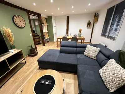 Coin salon dans l'établissement Au Duplex de Jeannala