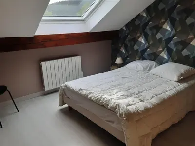 Un ou plusieurs lits dans un hébergement de l'établissement Appartement du parc