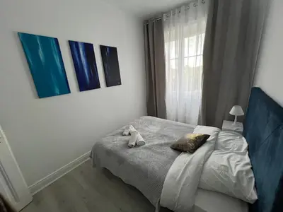 Un ou plusieurs lits dans un hébergement de l'établissement Esprit Forêt N0ire - appartement de luxe 3 chambres