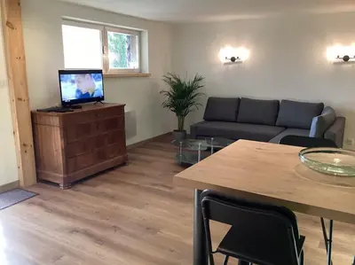 Télévision ou salle de divertissement dans l'établissement Au Talhorn chez Marc