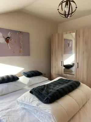 Un ou plusieurs lits dans un hébergement de l'établissement Le Martin Pêcheur - Appartement