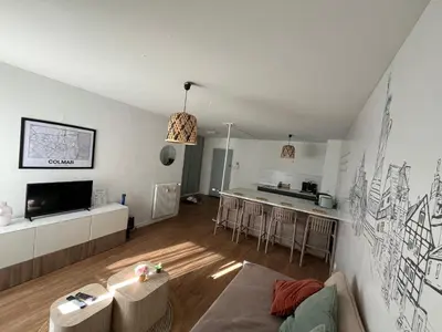 Coin salon dans l'établissement En plein Centre de Colmar avec Parking