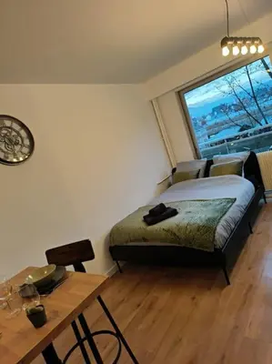 Un ou plusieurs lits dans un hébergement de l'établissement Charmant studio - Gare colmar