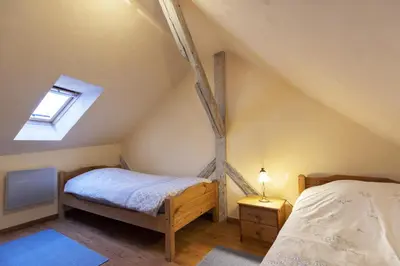 Un ou plusieurs lits dans un hébergement de l'établissement Maison en duplex