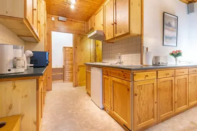 Cuisine ou kitchenette dans l'établissement Le Petit Sapin