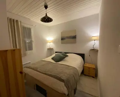 Un ou plusieurs lits dans un hébergement de l'établissement Gérardmer Appt 4/6 rez de jardin