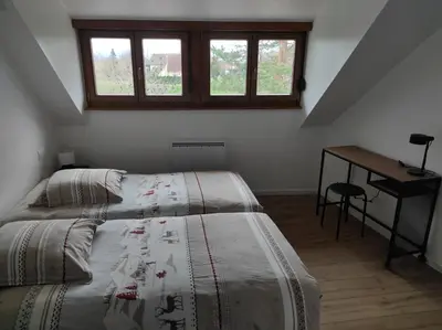 Un ou plusieurs lits dans un hébergement de l'établissement GÎTE D’EMMA