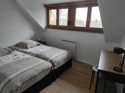 Un ou plusieurs lits dans un hébergement de l'établissement GÎTE D’EMMA