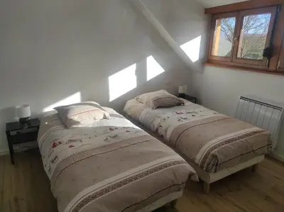 Un ou plusieurs lits dans un hébergement de l'établissement GÎTE D’EMMA