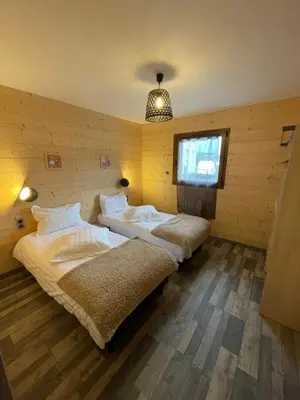 Un ou plusieurs lits dans un hébergement de l'établissement Le Chalet Du Castor