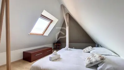 Un ou plusieurs lits dans un hébergement de l'établissement Villa Louisa