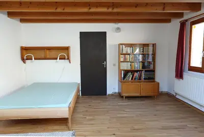 Un ou plusieurs lits dans un hébergement de l'établissement Appartement dans vielle ferme au coeur des Vosges