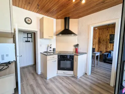 Cuisine ou kitchenette dans l'établissement Charmant appartement à Gérardmer