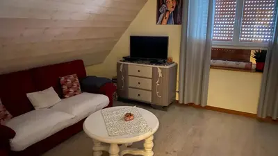 Télévision ou salle de divertissement dans l'établissement Logis en montagne chez Juju